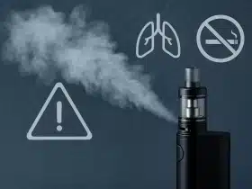 Fotografija vape uređaja s parom i jednostavnim grafičkim simbolima: znak opasnosti, pluća i zabrane pušenja.